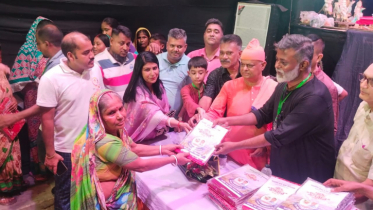 দলিত সম্প্রদায়ের মাঝে পূজার উপহার খোরশেদের 